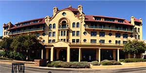 Historic Stockton building with Mediterranean architecture and arched windows, symbolizing the city’s cultural heritage