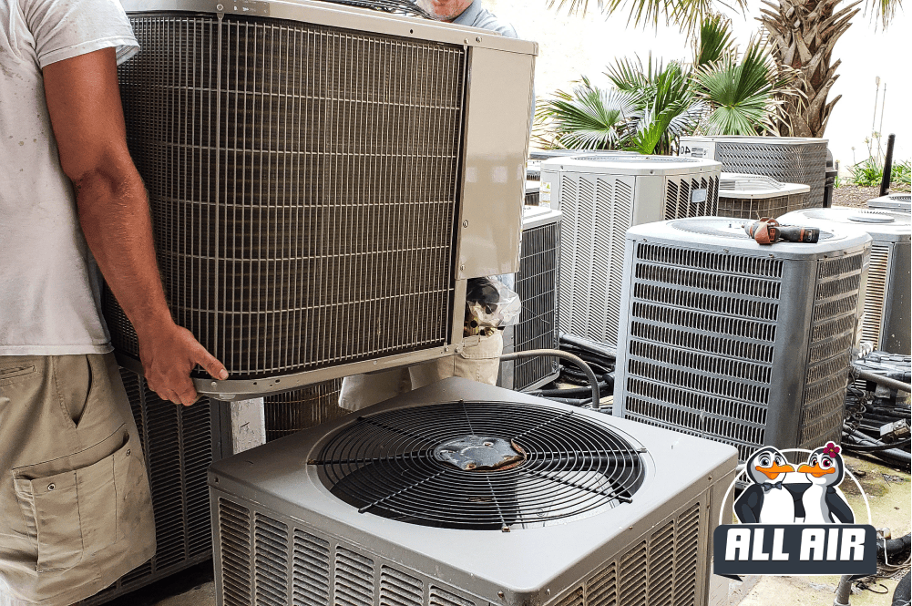 Multiple HVAC units undergoing routine maintenance by technicians to ensure optimal performance